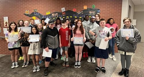 A photo of many students who recently won a Spartan Way award.